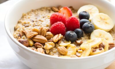 closeup of quinoa breakfast bowl with almond milk and fruit