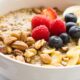 closeup of quinoa breakfast bowl with almond milk and fruit