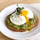 whole grain avocado toast with poached egg featured